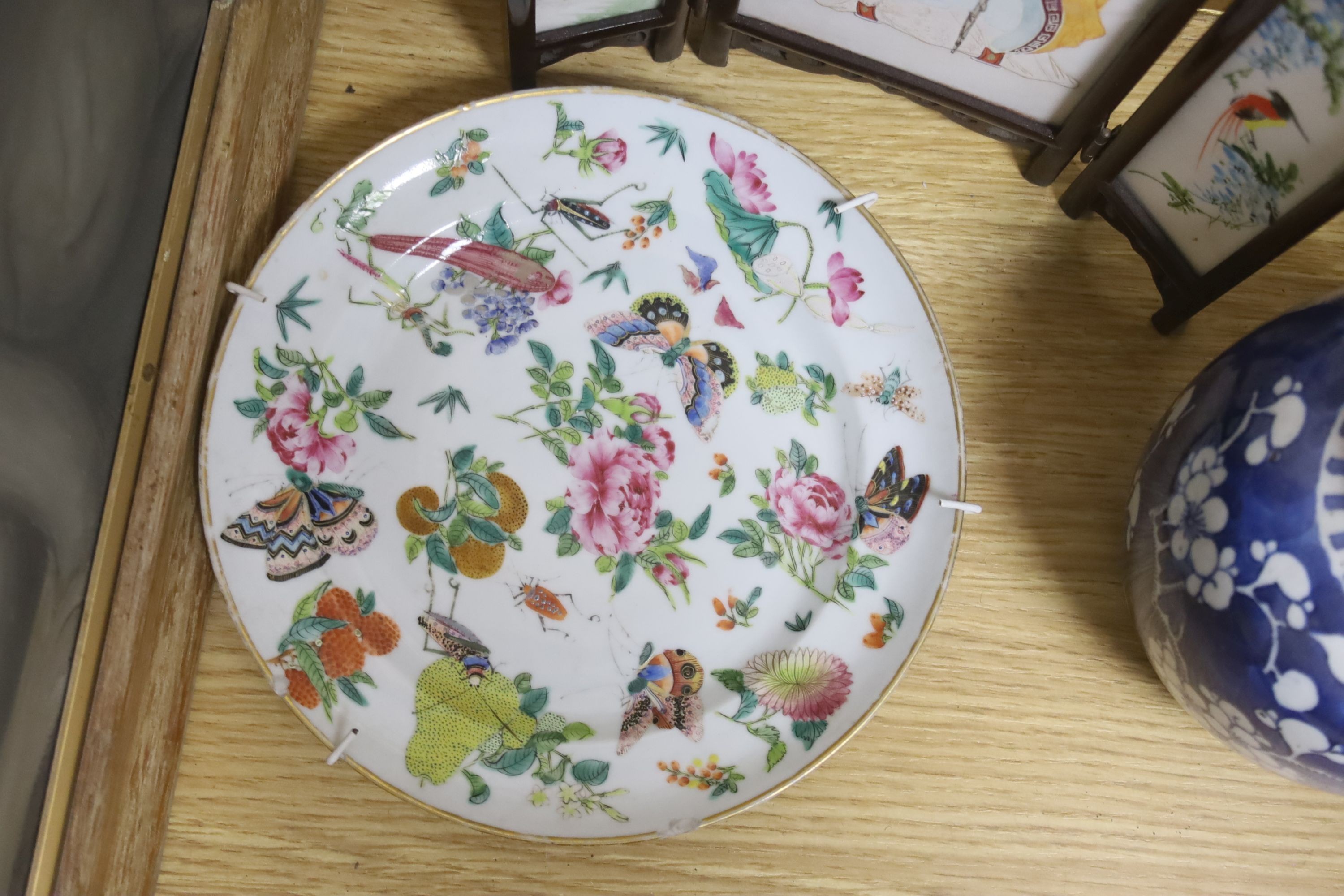 A Chinese miniature porcelain screen, a pair of jars, plate and folio of woodblock prints